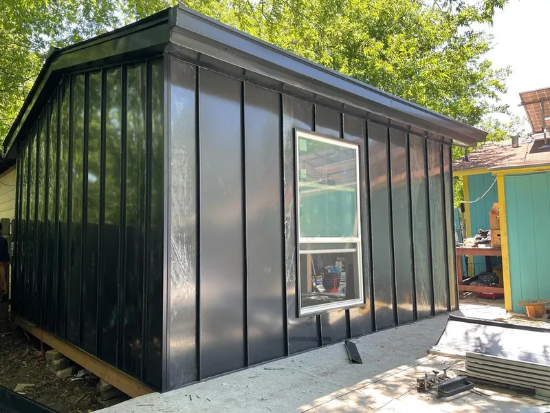 Black standing seam metal wall panels for Metal Roof Installation in Portage Lakes